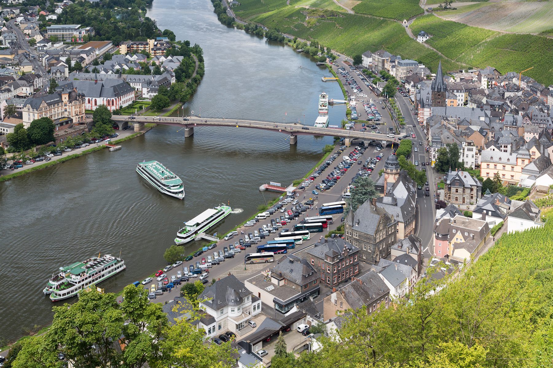 Aerial view of Bernkastel-Kues and its bridge over the Moselle, with vineyards above